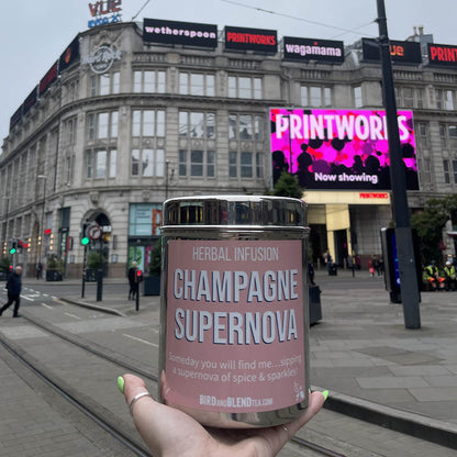 champagne supernova tea tin in town