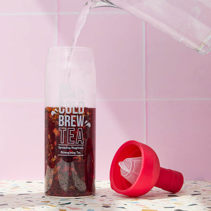 cold brew bottle pouring in liquid